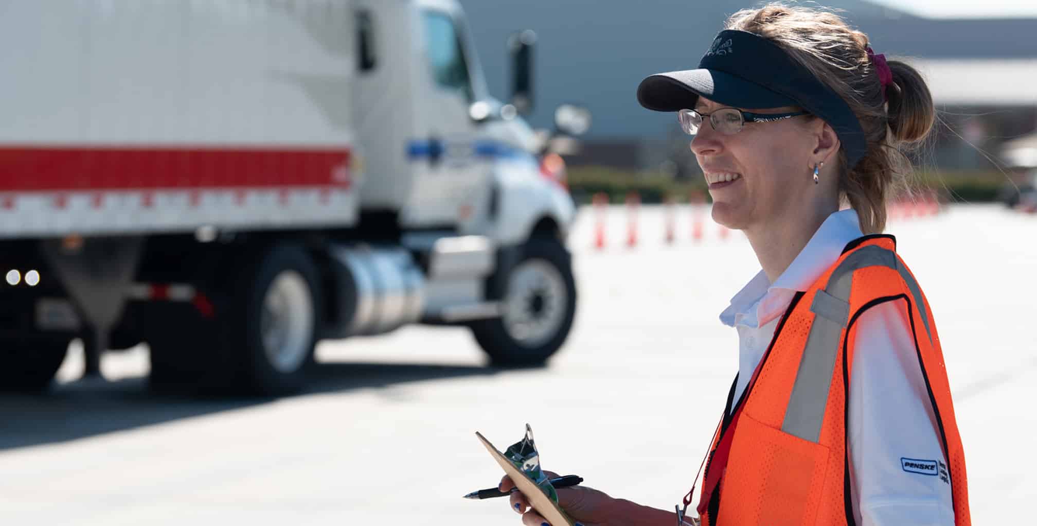 ifda woman truck driver holding clip board hero